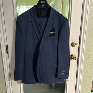 Navy blue “men’s” suit NWT never worn.
